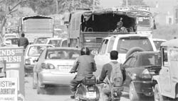 Diversion due to the construction of a railway overbridge near Dhakoli leads to traffic jam on the Zirakpur-Dhakoli road on Thursday. 