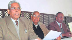 Justice SN Srivastava (retd) addresses a press conference in Dehradun on Thursday.