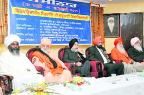 (From left) Mahant Bhagat Ramji and Swami Surinder Muni of Nirmal Akhara, Dr Jaspal Singh, VC, Punjabi University, Tarlochan Singh, RS MP, Jodh Singh of Nirmal Akhara, and Ravinder Dass of Brahm Buta Akhara, Amritsar, at a seminar in Dehradun