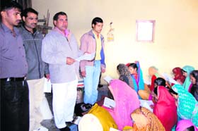 Women take exam at Kohand village in Karnal