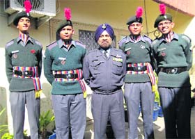 Wing Cdr HS Gulati (centre) and the cadets, who returned from the Republic Day Camp, pose for a photograph in Ludhiana