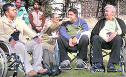 Differently abled persons relax after a meeting in Jalandhar on Thursday