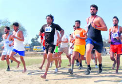 Candidates undergo a physical test for posts of constable in the state police in Bathinda on Thursday
