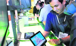 Bharat Gupta from CNN demonstrates CNNs live video app on Googles latest version of the Android operating system, Honeycomb, on a Motorola Xoom tablet device following a news conference at Google Headquarters in Mountain View, California, USA