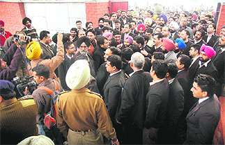 Seeking action against the DTO, lawyers protest outside the Cantonment police station in Amritsar on Friday.