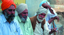 Residents of Giana village narrate their woes at their village in Bathinda district on Friday. 