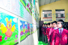 Children at an art and cartoon exhibition in Dehradun on Friday