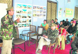 Ranger Dhiraj Rawat addresses the van panchayat members on the occasion of the forest fire safety week in Mussoorie on Friday
