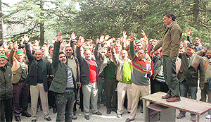 Employees of the Himachal Pradesh State Electricity Board protest at Kumar House in Shimla.