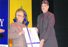 Bachan Lal gets the Presidential Appreciation Certificate from Finance Minister Pranab Mukherjee in New Delhi.