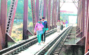 No lessons learnt: Just half an hour after a man was crushed under a train at this Lal Pul, residents of Jwalapur were seen crossing the bridge in Haridwar on Saturday.
