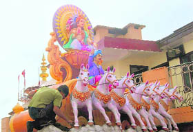 A worker gives the finishing touches to a newly installed idol at the Ram Mandir in Shimla on Saturday. 