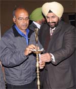 Prof Gill lights the lamp