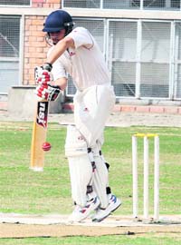 A player of APJ Academy, Kharar, in action during a cricket match against DAVSSS-8 held at St Stephens School in Sector 45, Chandigarh