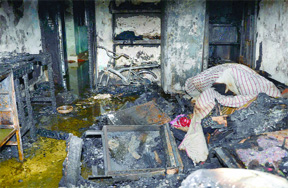 A gutted house in Laxmibai Nagar, New Delhi, on Sunday. 