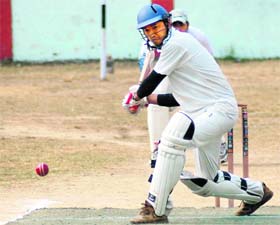 A batsman in action during a match in the 60th District Cricket League played at the Survey of India ground in Dehradun