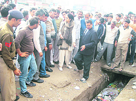 Public Health Minister Kiran Choudhry with officials during her visit to Bhiwani on Sunday.
