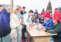 CM Prem Kumar Dhumal listen to public grievences at Khundian in Kangra district on Sunday. 
