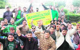 Members of the Jammu and Kashmir Agricultural Technocrats Association hold a demonstration in Jammu on Sunday. 