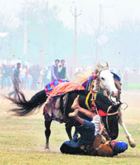 Gurjant Singh Jantta falls while performing on Sunday.