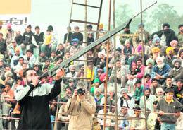 Amandeep Singh shows his skills with a mouth gun at Kila Raipur on Sunday. 