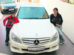 The white Mercedes Benz is Amans proud possession 