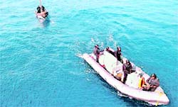 INS Tirs boat tows a captured pirate skiff off Lakshadweep islands on Sunday.