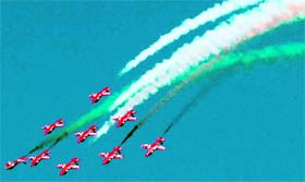 A Suryakiran team of the Indian Air Force rehearses for the Aero India-2011 in Bangalore on Sunday.