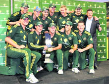 Australian One-Day team pose with the trophy after their win over England in Perth on Sunday.