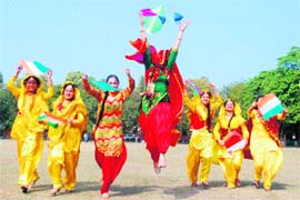 Students of MCM DAV College in a jubilant mood during the Basant Panchami celebrations in Chandigarh on Monday.