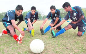 The selected football players for the U-19 national team during a practice session in Chandigarh
