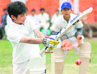 A batsman attempts a shot in a match of the Junior Boys Council School Cricket Tournament in Dehradun 