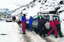 A fresh spell of snow leads to traffic jam on Monday on the Manali-Rohtang road.