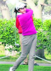 A woman golfer takes a shot during DLF Ladies Invitational Inter-Club Golf Tournament organised in Gurgaon. Tribune photo