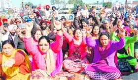 Members of the Punjab and Chandigarh Teachers Union protest in Amritsar