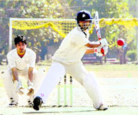 A batsman attempts a reverse sweep in a match of the Uttarakhand Twenty20 Cricket League Championship being played at Mahindra Ground in Dehradun on Tuesday