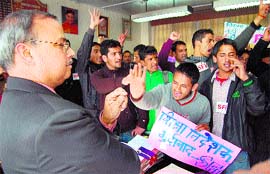 Protesters argue with Rajeev Sharma, director, Elementary Education, in Shimla on Tuesday.