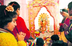 Children pray at the Kalibari temple on the occasion of Basant Panchami in Shimla on Tuesday.