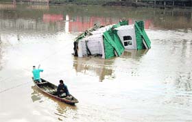 A houseboat which submerged in the Jhelum at Amira Kadal in Srinagar