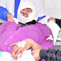 Injured Rajan Kumar, employee of a collection agency, recuperating in a hospital in Ludhiana. 