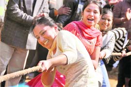 Judging their might: Girls participate in a tug-of-war on the occasion of Basant Panchami at GGNIMT