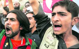 Activists of Pasban Pakistan shout slogans in Karachi during an anti-US protest against the US governments stand over Raymond Davis.