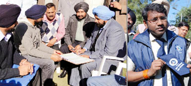 Mayor Baljeet Singh Birbehman (above) signing a Census information form at his residence as the second phase of the Census 2011 began in Bathinda on Wednesday; Deputy Commissioner S. Karuna Raju sports a tie bearing the logo of the Census-2011.
