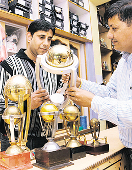 A cricket lover looks at the replica of the World Cup trophy in Chandigarh. Tribune photo: Manoj Mahajan