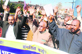 Members of the Bharat Mukhti Morcha hold a protest in Jammu 