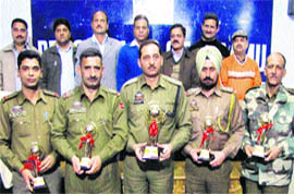 Police officers, who were felicitated by the Bus Stand Shopkeepers Association,