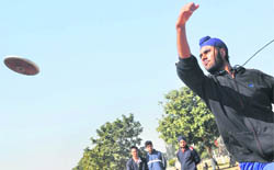 A student throws the discus during the fifth annual athletics meet of GADVASU at the PAU in Ludhiana.