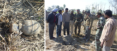 The grenade (left) lying on the ground; Army personnel, cops and other officials inspecting the site at village Rahime Uttar in Ferozepur district. A Tribune photograph