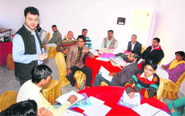 A trainer of the British Council provides tips in written and spoken English to teachers at Sirsa.