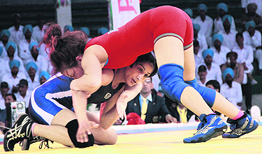 A wrestling bout between an Indian and a US player in progress during the Shaheed Bhagat Singh International Wrestling Tournament in Jalandhar Cantonment on Thursday. 